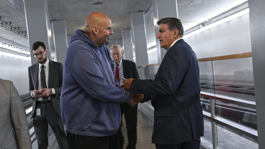 Sen. John Fetterman (D-Pa.) has a quick exchange with Sen. Joe Manchin (D-W.Va.).