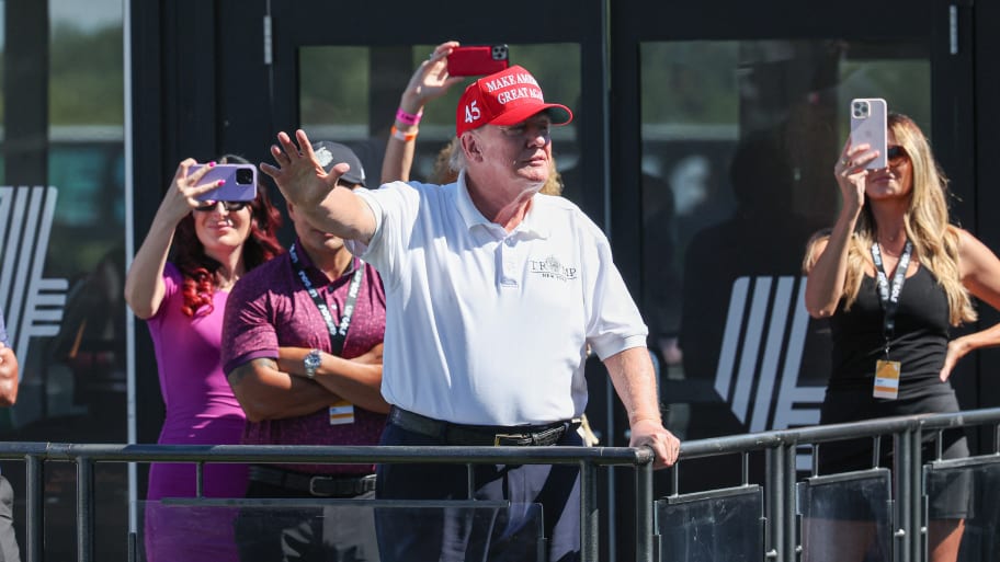 Former President Donald Trump waves to the fans during the final round of the LIV Golf Bedminster golf tournament at Trump National Bedminster on Aug. 13, 2023.