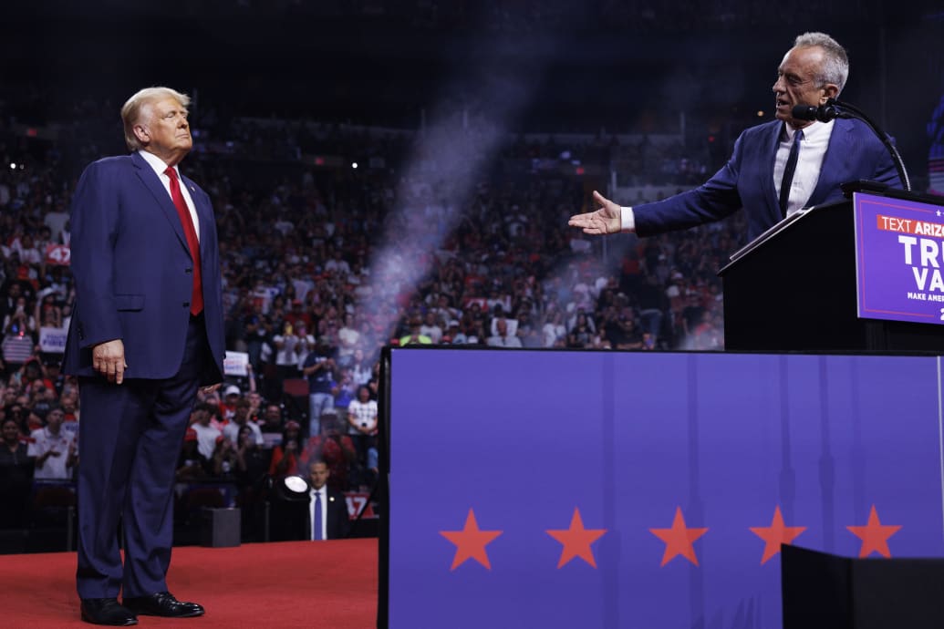 Robert F. Kennedy Jr. speaks on stage beside Republican presidential nominee Donald Trump during a campaign event in Glendale, AZ.