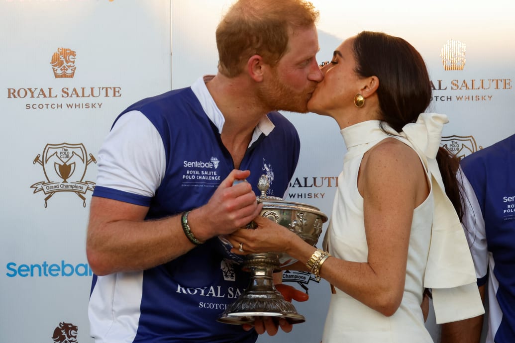 Prince Harry and Meghan Markle kiss as they attend the Royal Salute Polo Challenge to benefit Sentebale, a charity founded by him and Prince Seeiso of Lesotho to support children in Lesotho and Botswana , in Wellington, Florida, USA, April 12, 2024.