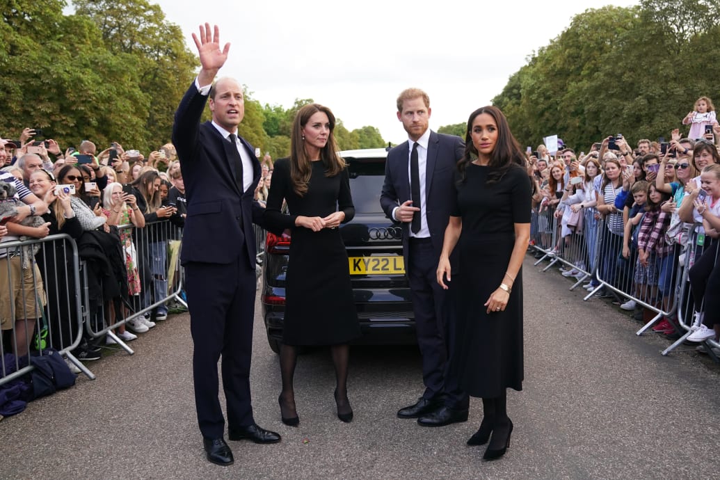 Catherine, Princess of Wales, Prince William, Prince of Wales, Prince Harry, Duke of Sussex, and Meghan, Duchess of Sussex meet members of the public on the long Walk at Windsor Castle on September 10, 2022 in Windsor, England.