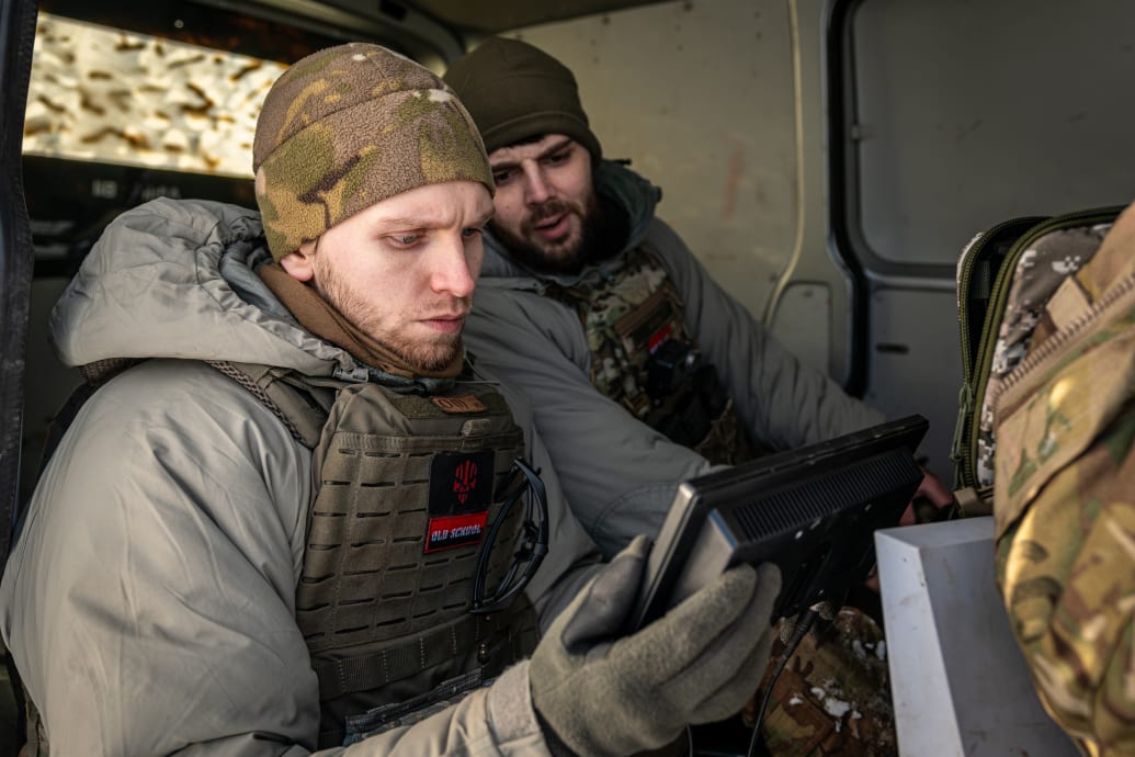 Ukrainian soldiers monitor the signal of a long range drone flying near the Bakhmut frontline, in Donetsk Oblast, Ukraine on January 12, 2024. 
