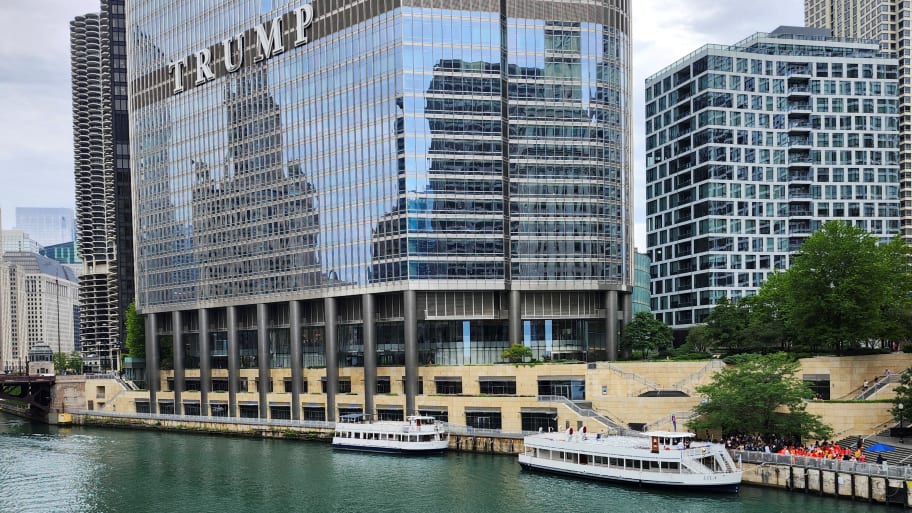 Kayakers on the Chicago River paddle toward Trump Tower in Chicago, Illinois, on Aug. 1, 2024. 