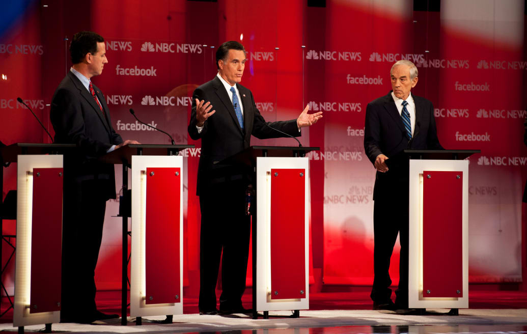 A photograph from the NBC-Facebook Republican Presidential debate between ick Santorum, Mitt Romney, and Ron Paul in 2012.