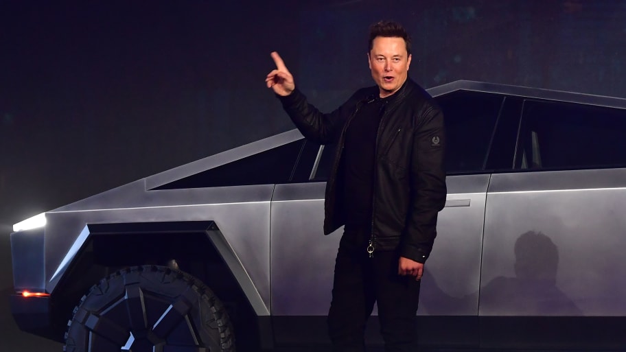 Tesla co-founder and CEO Elon Musk gestures while introducing the newly unveiled all-electric battery-powered Tesla Cybertruck in 2019. 