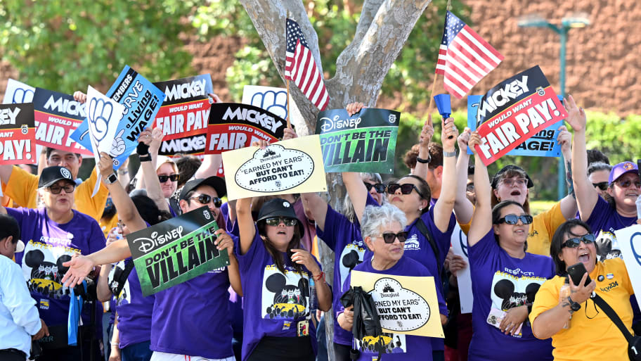 Disney employees rally outside the main entrance of Disneyland Resort in Anaheim, California, on July 17, 2024, ahead of a planned strike authorization vote.