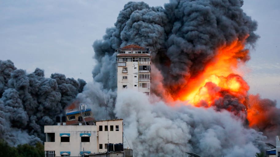 Smoke and flames billow after Israeli forces struck a high-rise tower in Gaza City.