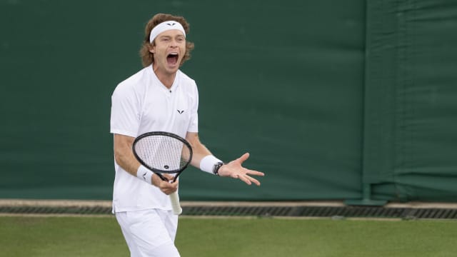 Andrey Rublev reacts to a point during his match against Francisco Comesana of Argentina on day two of The Championships at All England Lawn Tennis and Croquet Club. 