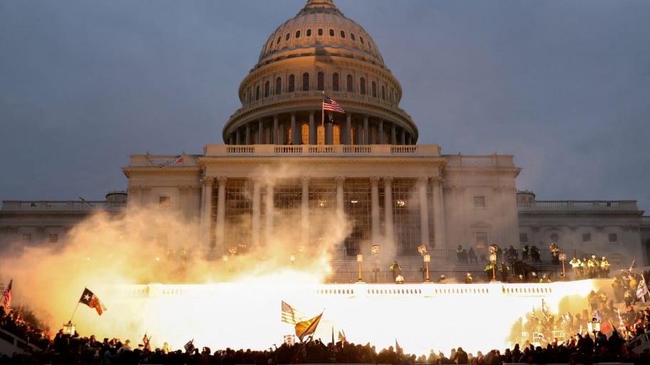 An explosion caused by a police munition is seen while supporters of U.S. President Donald Trump riot at the U.S. Capitol Building in Washington, U.S.