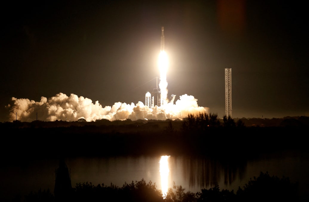 A space rocket takes off at night