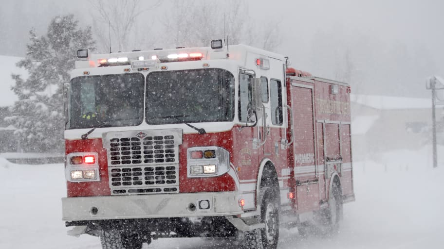 Firefighters respond to a call as snow continues to fall in Truckee, Calif., on Saturday, March 2, 2024. 