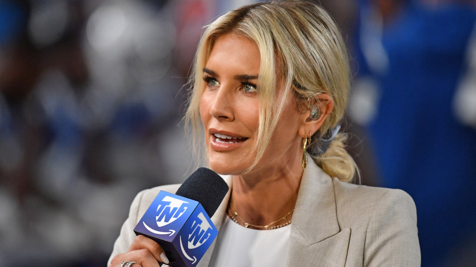 Charissa Thompson, holding a microphone, speaks during a broadcast of Prime Video’s Thursday Night Football.