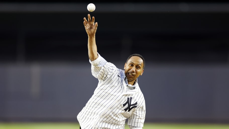 American TV personality Stephen A. Smith throws a ceremonial first pitch before the first inning of the game