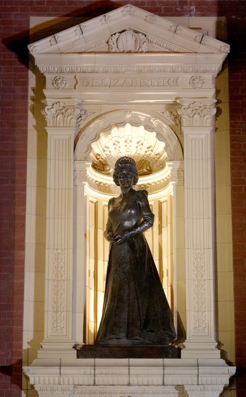 A statue of Britain's Queen Elizabeth is lit up after unveiling by Britain's King Charles upon his arrival to attend the Royal British Legion Festival of Remembrance at the Royal Albert Hall in London, Britain, November 11, 2023.