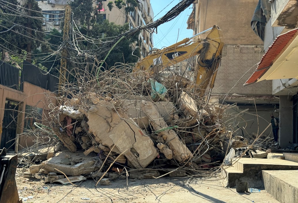 Heavy machinery operates to remove the rubble of a damaged building, the day after an Israeli strike in Beirut's southern suburbs.