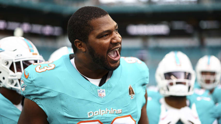 Calais Campbell #93 of the Miami Dolphins gives a speech in the team huddle prior to an NFL preseason football game against the Washington Commanders at Hard Rock Stadium on August 17, 2024 in Miami Gardens, FL. 