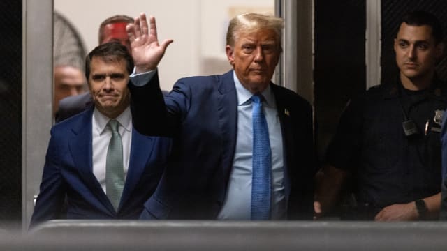Former U.S. President Donald Trump returns from a break to the courtroom at Manhattan Criminal Court in New York, US, on Friday, April 26, 2024. 