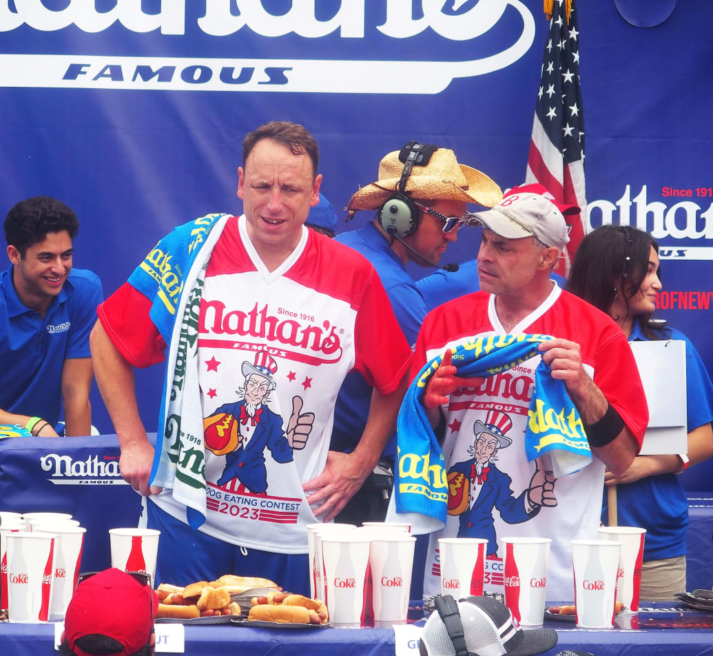 Joey Chestnut and Geoffrey Esper during the 2023 Nathan's Famous International Hot Dog Eating Contest at Coney Island on July 4, 2023