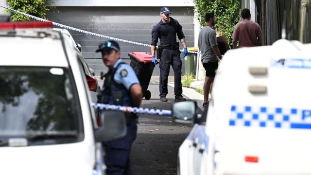 Police officers work at a crime scene at Waite Road in Paddington, Sydney, Australia  February 23, 2024.