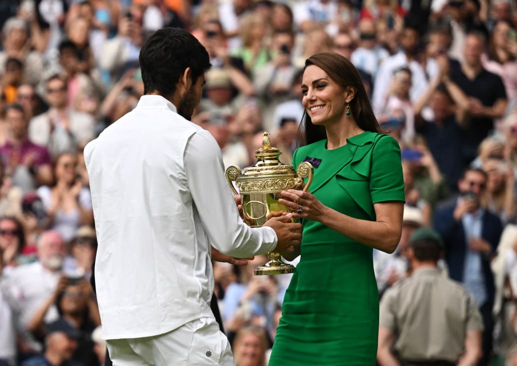 Kate Middleton presents the 2023 Wimbledon men's championship trophy to Spaniard Carlos Alcaraz.