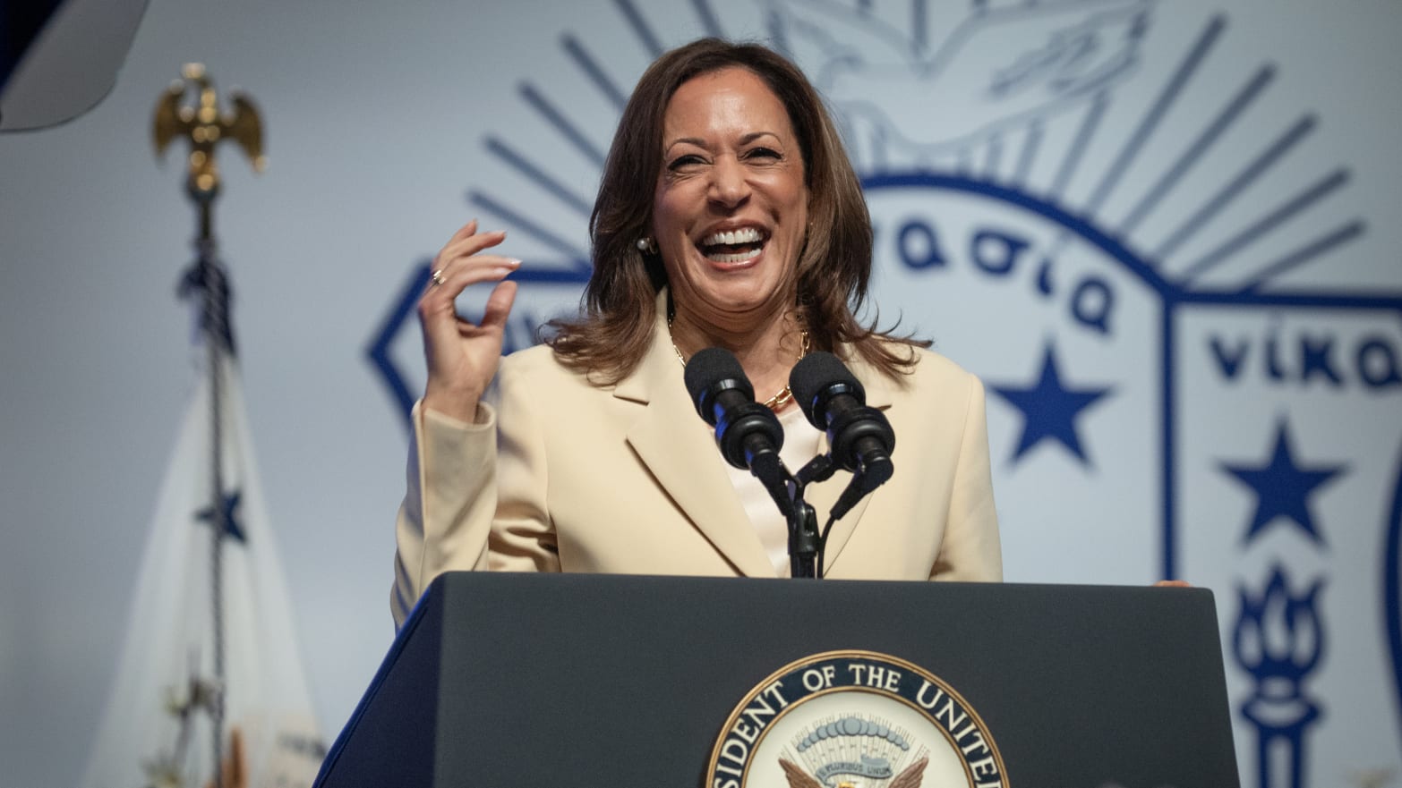 Kamala Harris in front of Zeta Phi Beta insignia