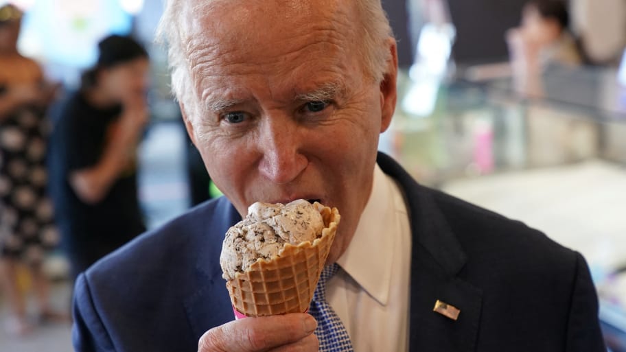 President Joe Biden eats an ice cream during a stop at an ice cream shop in Portland, Oregon.