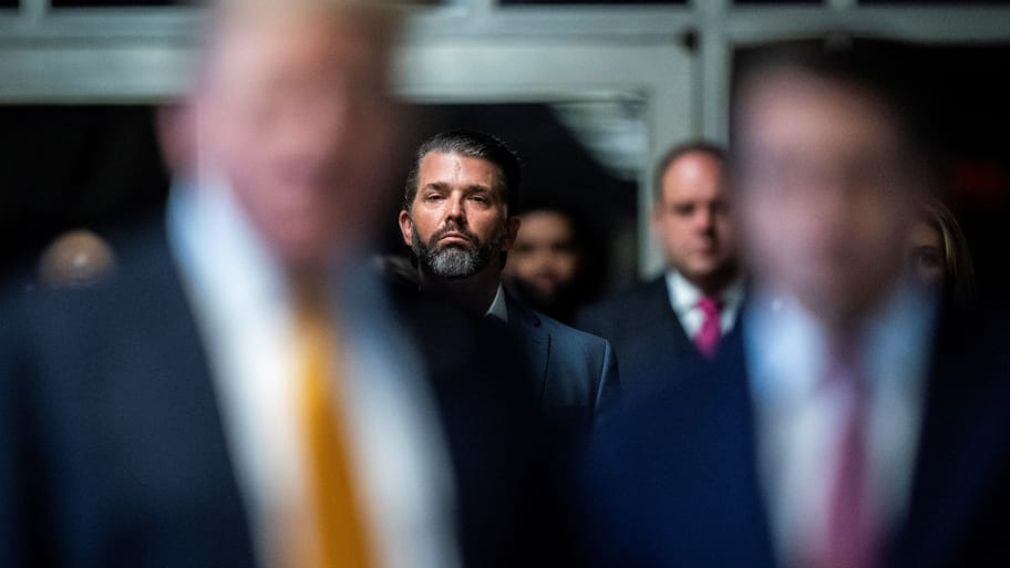 Donald Trump Jr. listens as former President Donald Trump speaks to reporters as jurors are released to begin deliberations for his criminal trial at the Manhattan Criminal Court in New York, NY on Wednesday, May 29, 2024. 