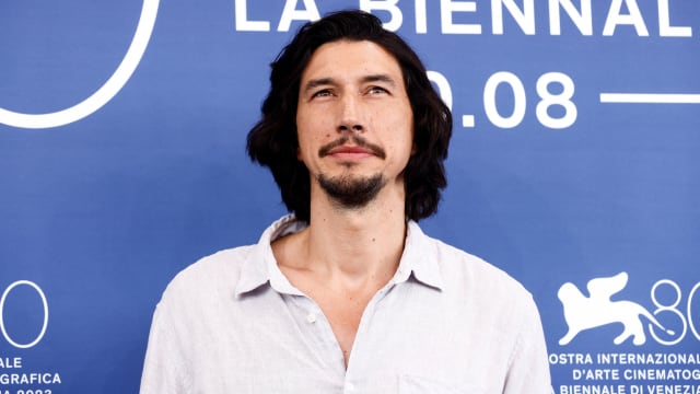 Adam Driver poses for a photo at the Venice Film Festival