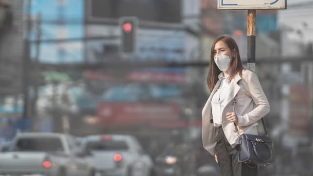 Woman going to work wearing N95 mask.