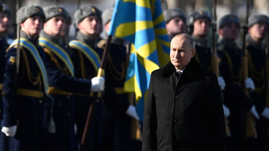 Vladimir Putin takes part in a wreath laying ceremony at the Tomb of the Unknown Soldier by the Kremlin Wall on the Defender of the Fatherland Day in Moscow, Russia, February 23, 2023. 