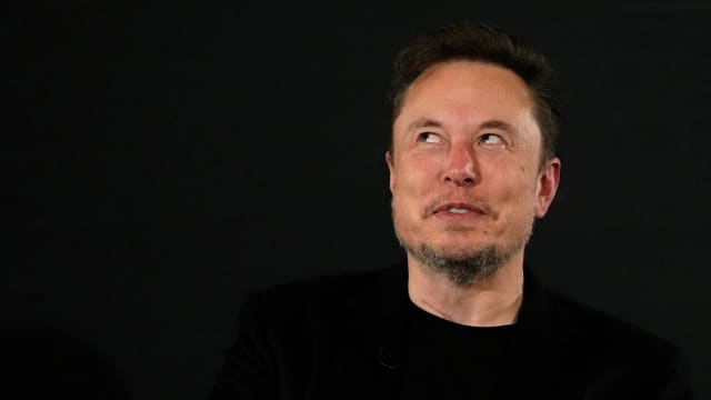 Elon Musk reacts during an in-conversation event with British Prime Minister Rishi Sunak in London, Britain, November 2, 2023. 