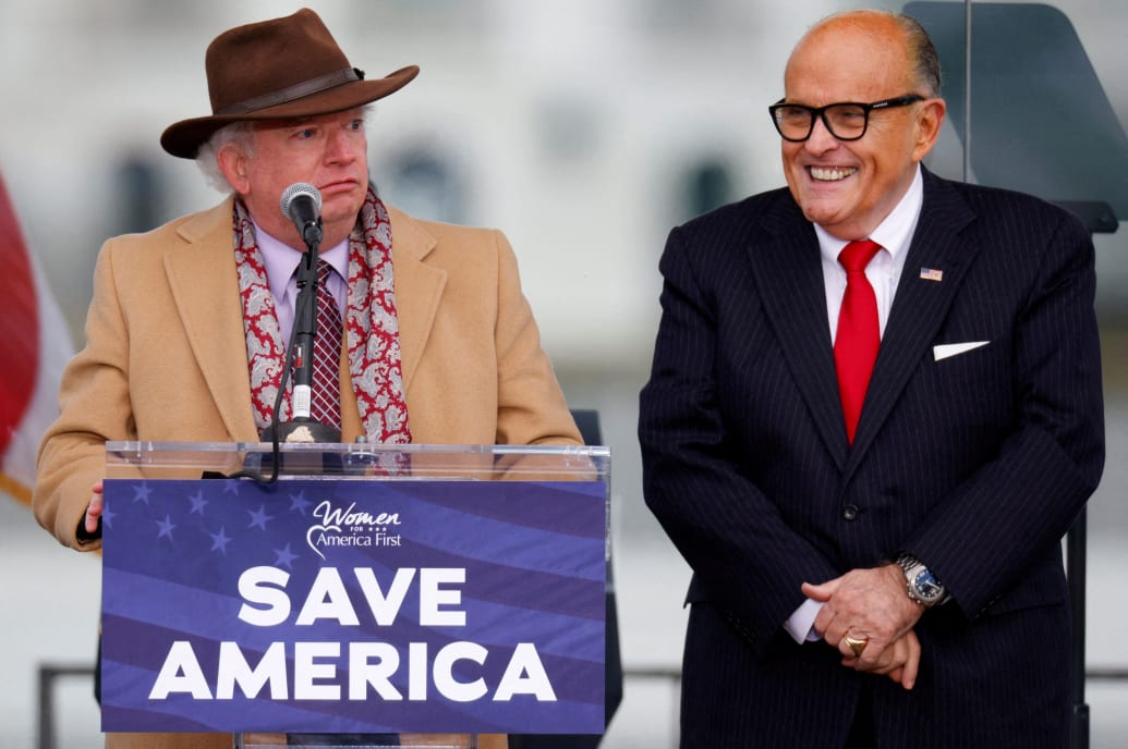 John Eastman speaks next to Rudy Giuliani as Trump supporters gather ahead of the president’s speech to contest the certification by the U.S. Congress of the results of the 2020 U.S. presidential election in Washington, January 6, 2021. 