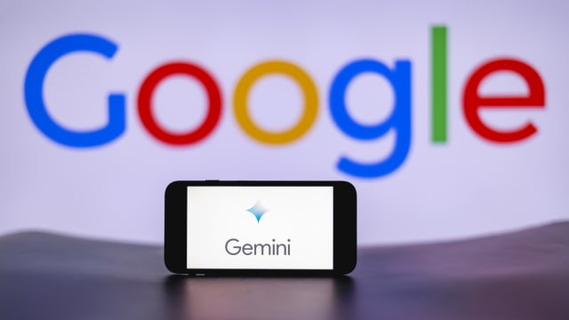 In this photo illustration, the Gemini logo is seen displayed on a mobile phone screen with Google logo in the background. 
