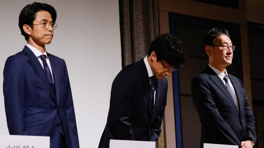 Japan’s talent agency Johnny & Associates Chief Noriyuki Higashiyama, flanked by CEO of Johnny’s Island Yoshihiko Inohara and their lawyer Hiroshi Kimeda, bows at the start of their news conference in Tokyo, Japan, Oct. 2, 2023. 