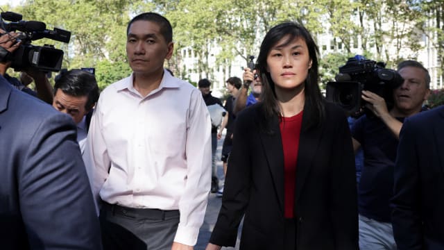 Linda Sun, a former aide to New York State Governor Kathy Hochul, exits Brooklyn Federal court with Chris Hu