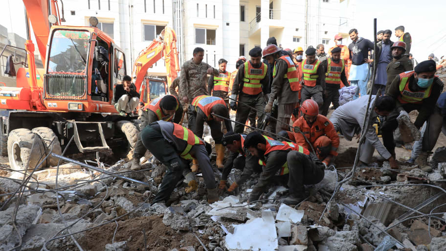 Rescue workers clear the rubble as they search for victims, after a suicide blast in a mosque in Peshawar, Pakistan January 31, 2023.