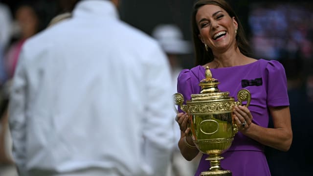 Catherine, Princess of Wales prepares to give the winner's trophy to Spain's Carlos Alcaraz following his victory against Serbia's Novak Djokovic 