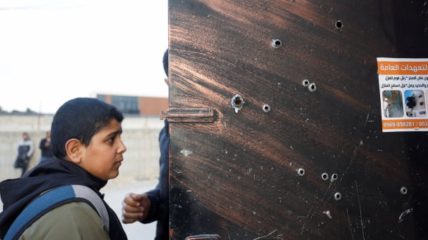 Bullet holes are pictured on a door at the scene where Israeli forces killed a number of armed fighters during a raid at a refugee camp near Jericho on Feb. 6, 2023.