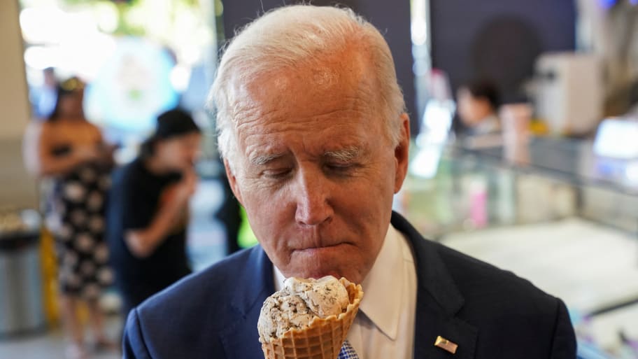 Joe Biden eats an ice cream during a stop at an ice cream shop in Portland, Oregon, Oct. 15, 2022. 