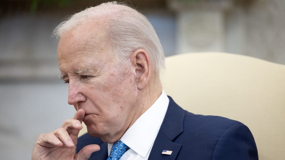 President Joe Biden listens to Italian Prime Minister Giorgia Meloni.