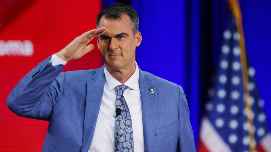 Oklahoma Governor Kevin Stitt gestures onstage at the Conservative Political Action Conference (CPAC) in Dallas, Texas, U.S., August 5, 2022.  