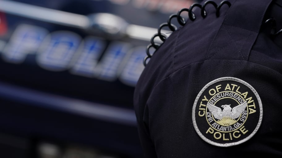 The Atlanta Police Department logo is seen on an Atlanta Police Department officer