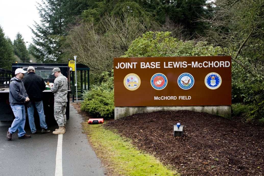 A picture of a road sign reading: Joint Base Lewis-McChord.