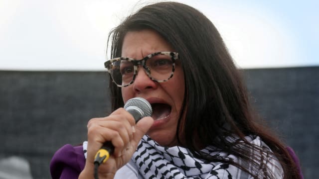 Rashida Tlaib (MI-12) addresses attendees as she takes part in a protest calling for a ceasefire in Gaza
