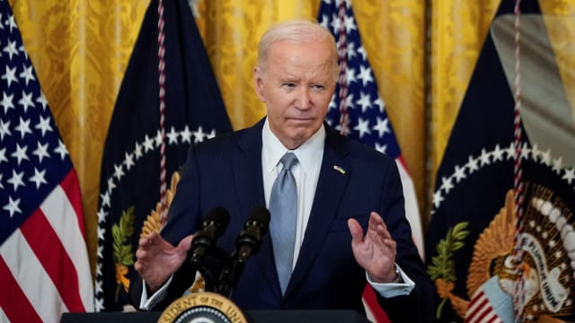 Joe Biden speaks to reporters during a press conference.