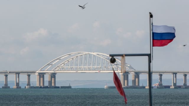 A view taken on October 14, 2022 shows the Kerch Bridge that links Crimea to Russia, near Kerch, which was hit by a blast on October 8, 2022.