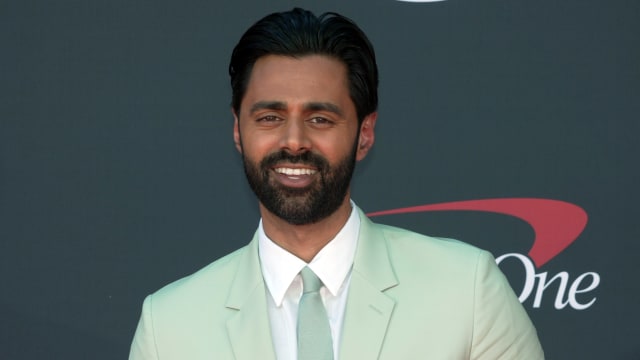 Comedian Hasan Minhaj poses on the red carpet at the 2023 ESPYs.