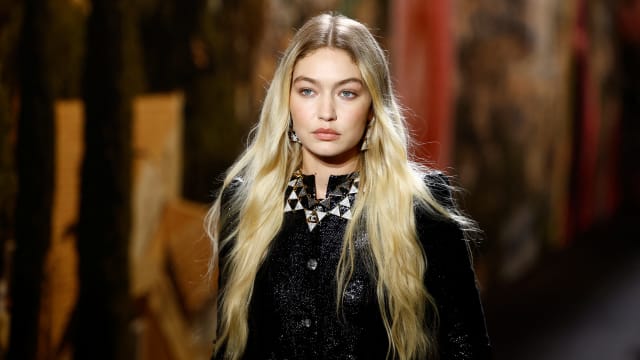Gigi Hadid presents a creation by designer Virginie Viard as part of her Spring/Summer 2024 Women's ready-to-wear collection show