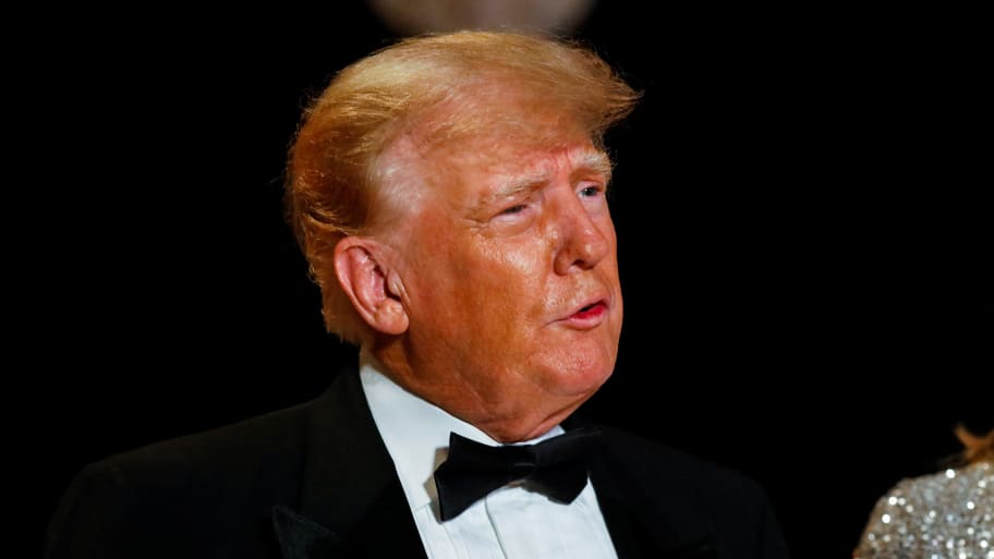 Donald Trump wears a suit with a bowtie at Mar-a-Lago