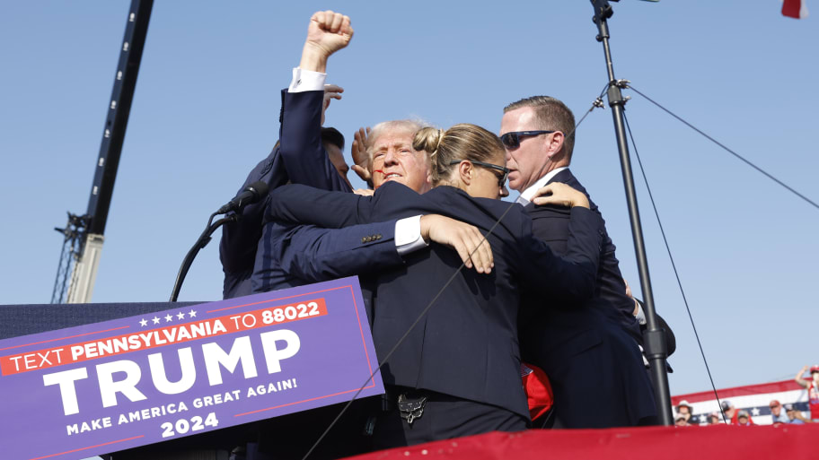 Republican presidential candidate former President Donald Trump is rushed offstage during a rally on July 13, 2024 in Butler, Pennsylvania.